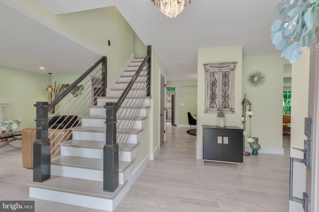 11726 Lariat Ln, Oakton, VA 22124 - stairway featuring wood finished floors and a chandelier