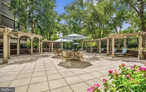 4620 N Park Ave N Unit 502W, Chevy Chase, MD 20815 - view of patio / terrace with a pergola and outdoor dining space