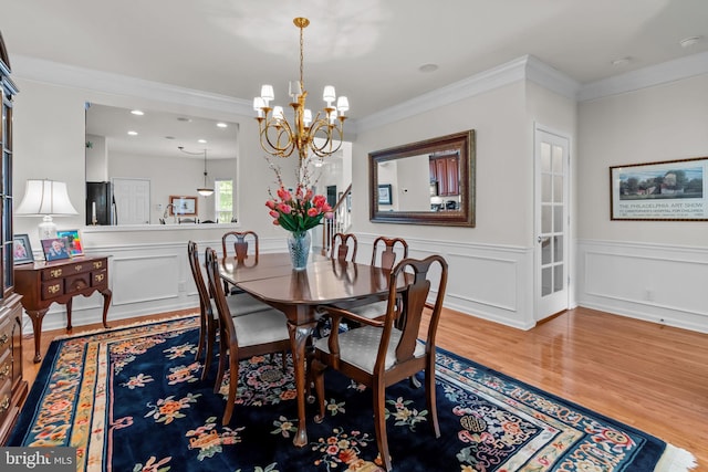 14 Mcconkey Dr, Washington Crossing, PA 18977 - dining area with wood finished floors, a chandelier, ornamental molding, a wainscoted wall, and recessed lighting
