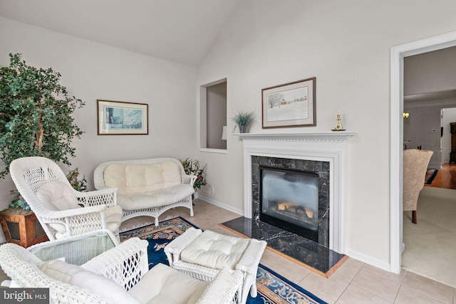 14 Mcconkey Dr, Washington Crossing, PA 18977 - living area with a premium fireplace, tile patterned flooring, and vaulted ceiling