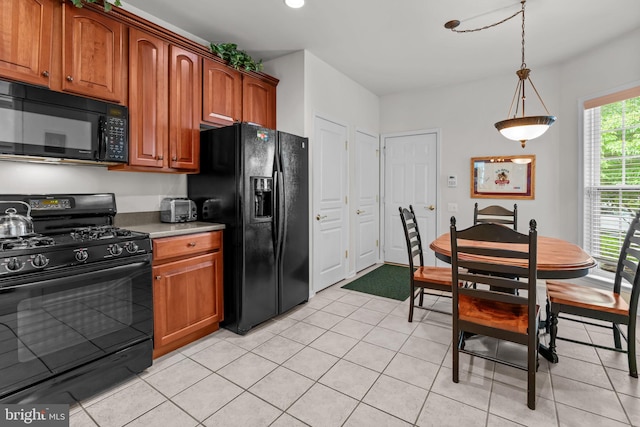 14 Mcconkey Dr, Washington Crossing, PA 18977 - kitchen with black appliances, light tile patterned flooring, brown cabinets, and recessed lighting
