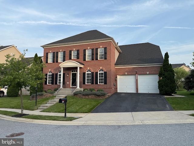 5333 Kenzie Audrey Ct, Perry Hall, MD 21128 - colonial home with brick siding, an attached garage, asphalt driveway, a front lawn, and roof with shingles