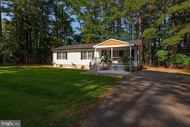 120 Robin Hood, Ocean Pines, MD 21811 - view of front facade with a porch, a front lawn, and asphalt driveway