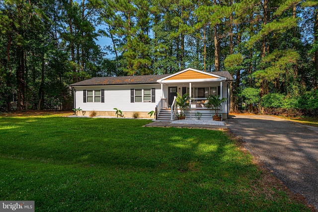 120 Robin Hood, Ocean Pines, MD 21811 - view of front facade with covered porch, asphalt driveway, and a front yard