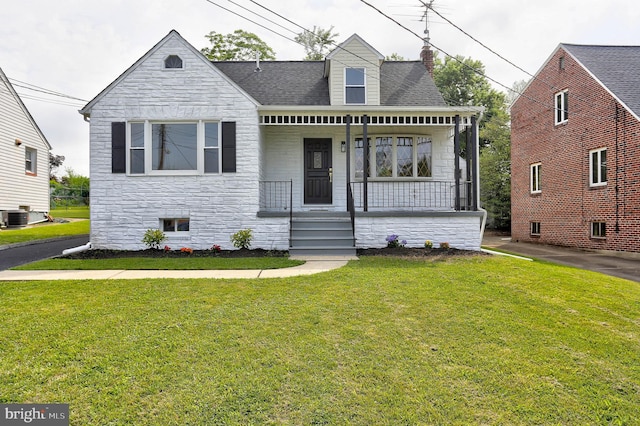1204 Krueger Ave, Rosedale, MD 21237 - view of front of property with stone siding, a porch, a front yard, a chimney, and roof with shingles