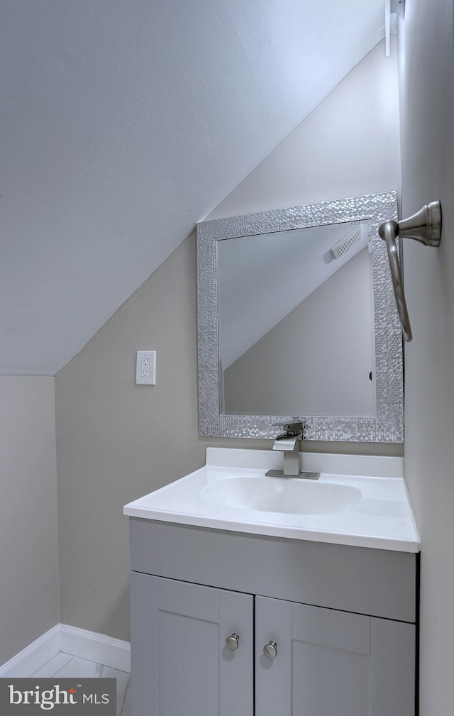 1204 Krueger Ave, Rosedale, MD 21237 - bathroom with vaulted ceiling and vanity