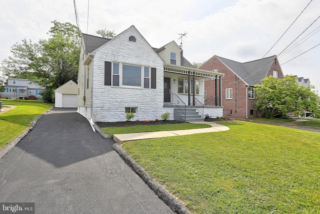 1204 Krueger Ave, Rosedale, MD 21237 - view of front facade with stone siding, a garage, an outdoor structure, and a front lawn