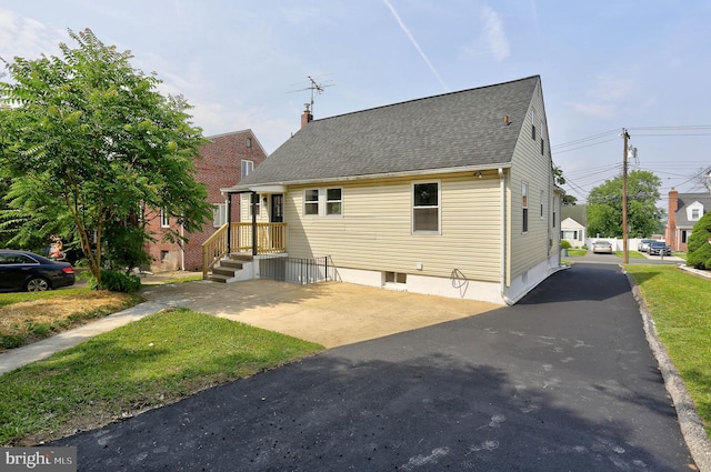 1204 Krueger Ave, Rosedale, MD 21237 - view of front of property with a shingled roof and a chimney