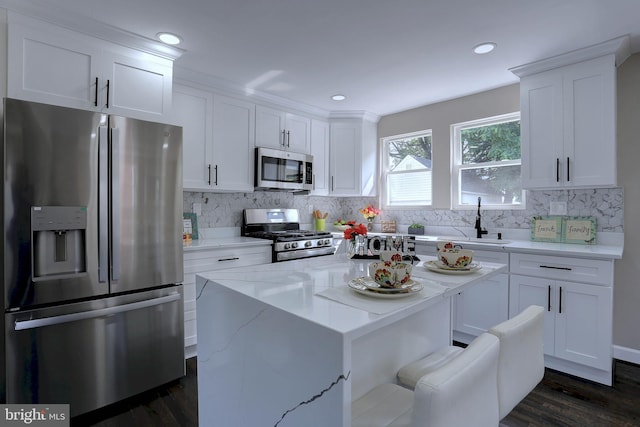 1204 Krueger Ave, Rosedale, MD 21237 - kitchen featuring appliances with stainless steel finishes, dark wood-style flooring, white cabinets, backsplash, and light stone countertops