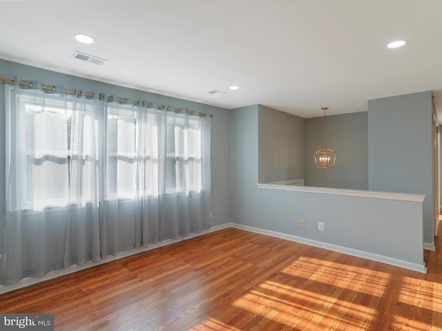 8175 Stone Bridge Rd, Greencastle, PA 17225 - empty room featuring a chandelier, wood finished floors, and recessed lighting