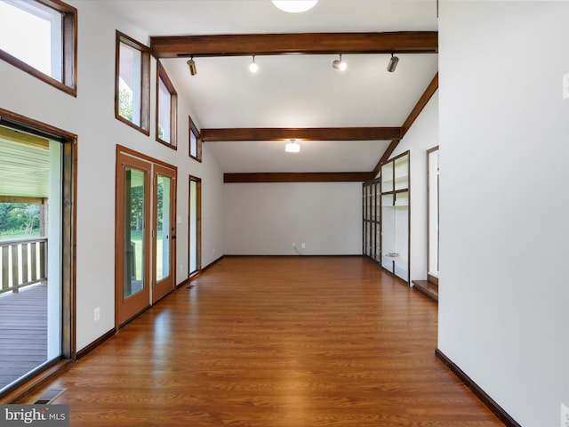 8175 Stone Bridge Rd, Greencastle, PA 17225 - unfurnished room featuring beamed ceiling, french doors, rail lighting, wood finished floors, and high vaulted ceiling