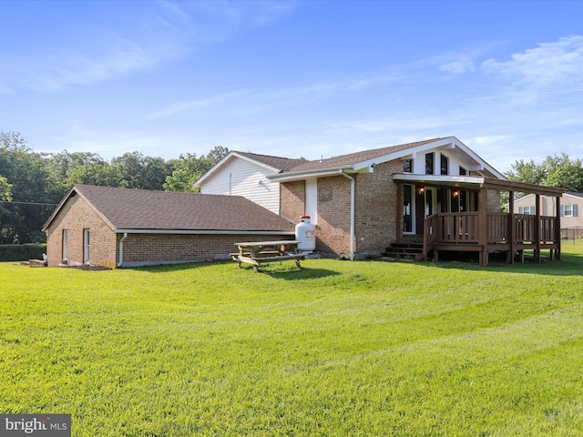 8175 Stone Bridge Rd, Greencastle, PA 17225 - rear view of house with brick siding, a lawn, and a deck