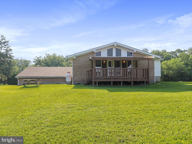 8175 Stone Bridge Rd, Greencastle, PA 17225 - back of property featuring brick siding, a lawn, and a deck