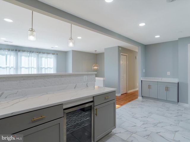 8175 Stone Bridge Rd, Greencastle, PA 17225 - kitchen with wine cooler, gray cabinetry, light marble finish floors, recessed lighting, and pendant lighting