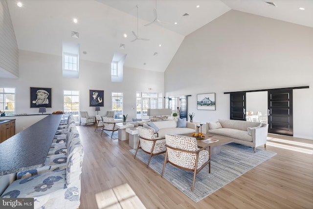 15429 Solomon Way, Lewes, DE 19958 - living room with high vaulted ceiling, ceiling fan, light wood-style flooring, and recessed lighting