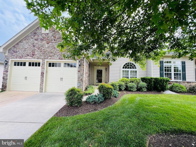 11037 Doxberry Cir Unit 15, Woodstock, MD 21163 - view of front facade featuring stone siding, driveway, an attached garage, and a front yard