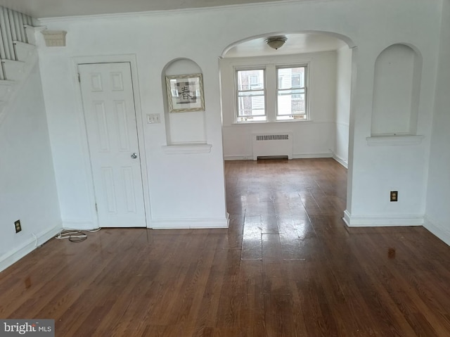 1420 Magee Ave, Philadelphia, PA 19111 - unfurnished room with radiator, wood finished floors, arched walkways, and ornamental molding