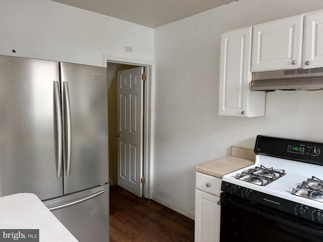 1420 Magee Ave, Philadelphia, PA 19111 - kitchen with freestanding refrigerator, gas stove, under cabinet range hood, dark wood-type flooring, and white cabinetry