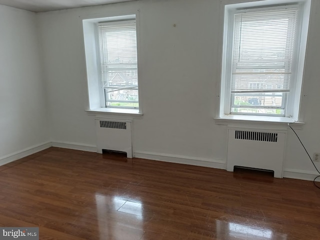1420 Magee Ave, Philadelphia, PA 19111 - spare room featuring radiator heating unit and wood finished floors