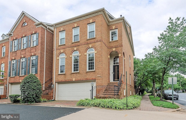 712 Arch Hall Ln, Alexandria, VA 22314 - view of front of property featuring brick siding, an attached garage, and driveway