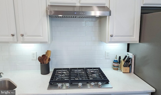 712 Arch Hall Ln, Alexandria, VA 22314 - kitchen featuring extractor fan, stainless steel gas stovetop, tasteful backsplash, and white cabinets
