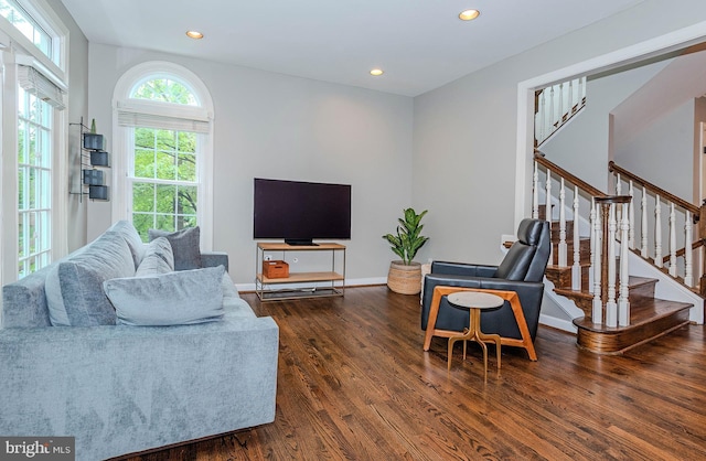 712 Arch Hall Ln, Alexandria, VA 22314 - living area with wood finished floors, stairway, and recessed lighting
