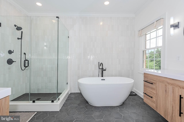 712 Arch Hall Ln, Alexandria, VA 22314 - full bathroom with vanity, a freestanding tub, a stall shower, ornamental molding, and tile patterned flooring