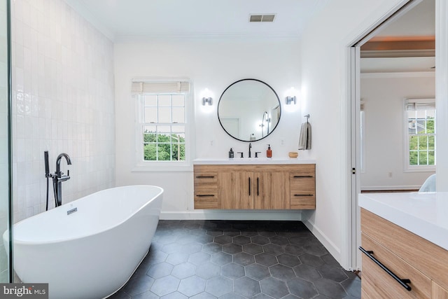 712 Arch Hall Ln, Alexandria, VA 22314 - full bath featuring vanity, plenty of natural light, a soaking tub, crown molding, and tile patterned floors