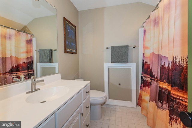 712 Arch Hall Ln, Alexandria, VA 22314 - bathroom with lofted ceiling, vanity, and tile patterned floors