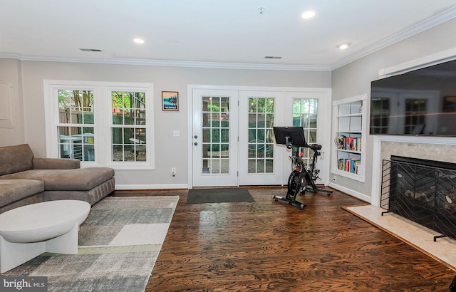 712 Arch Hall Ln, Alexandria, VA 22314 - exercise room with healthy amount of natural light, wood finished floors, recessed lighting, a fireplace, and ornamental molding