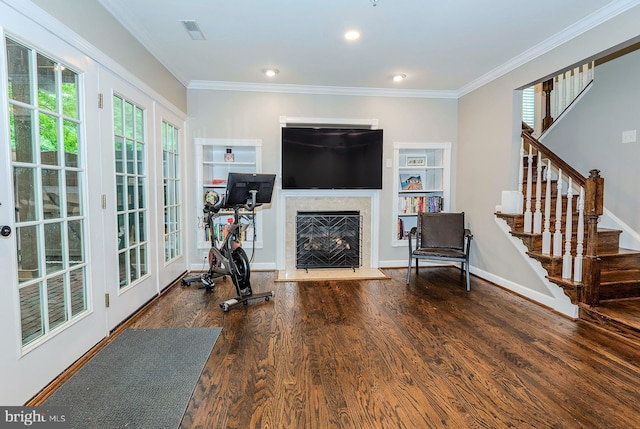712 Arch Hall Ln, Alexandria, VA 22314 - exercise area with crown molding, wood finished floors, a fireplace, built in features, and recessed lighting