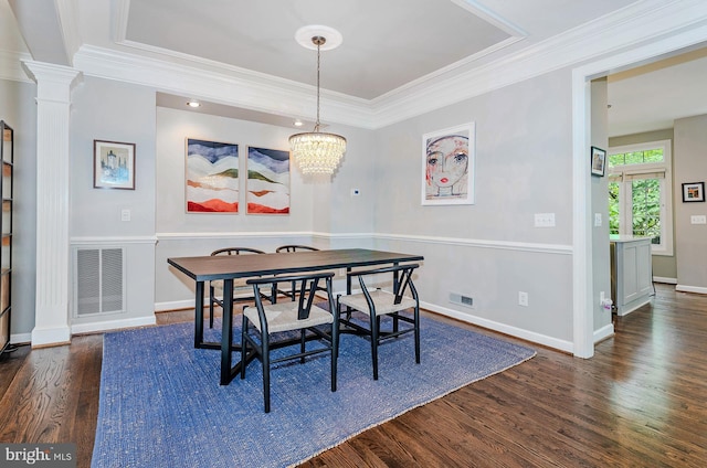 712 Arch Hall Ln, Alexandria, VA 22314 - dining space with wood finished floors, a chandelier, decorative columns, ornamental molding, and a tray ceiling