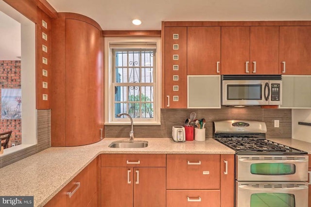 1831MUTLI-UNIT Spruce St, Philadelphia, PA 19103 - kitchen featuring stainless steel appliances, tasteful backsplash, and light stone countertops