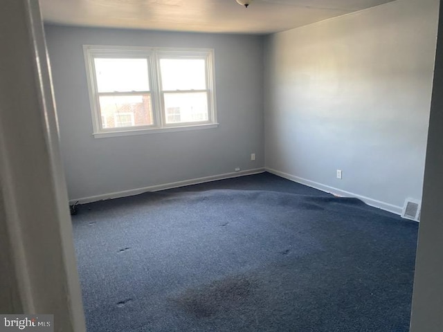 3720 Conshohocken Ave, Philadelphia, PA 19131 - spare room with dark carpet and baseboards