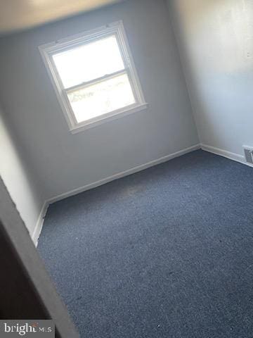 3720 Conshohocken Ave, Philadelphia, PA 19131 - unfurnished room with dark carpet and baseboards