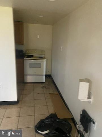 3720 Conshohocken Ave, Philadelphia, PA 19131 - kitchen with white range with electric cooktop and light tile patterned floors