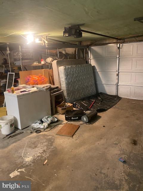 3720 Conshohocken Ave, Philadelphia, PA 19131 - garage with a garage door opener and refrigerator