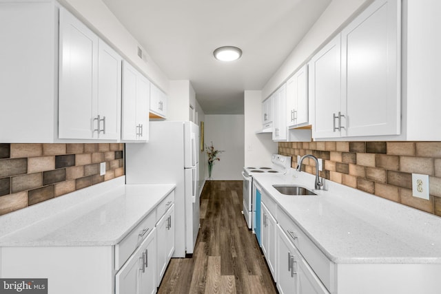 435 Christopher Ave Unit 23, Gaithersburg, MD 20879 - kitchen with white appliances, dark wood-style flooring, white cabinets, and backsplash