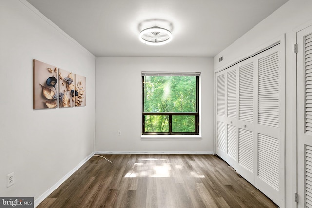 435 Christopher Ave Unit 23, Gaithersburg, MD 20879 - unfurnished bedroom with wood finished floors and a closet