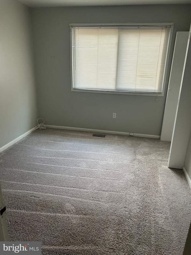 123 Big Chimney Br Unit 9-4, Upper Marlboro, MD 20774 - carpeted empty room with plenty of natural light