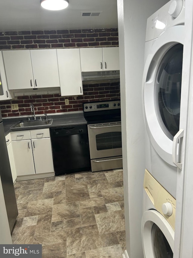 123 Big Chimney Br Unit 9-4, Upper Marlboro, MD 20774 - kitchen with dishwasher, stainless steel electric stove, stacked washing machine and dryer, under cabinet range hood, and dark countertops