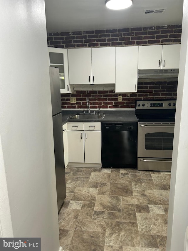123 Big Chimney Br Unit 9-4, Upper Marlboro, MD 20774 - kitchen with appliances with stainless steel finishes, under cabinet range hood, dark countertops, and white cabinets