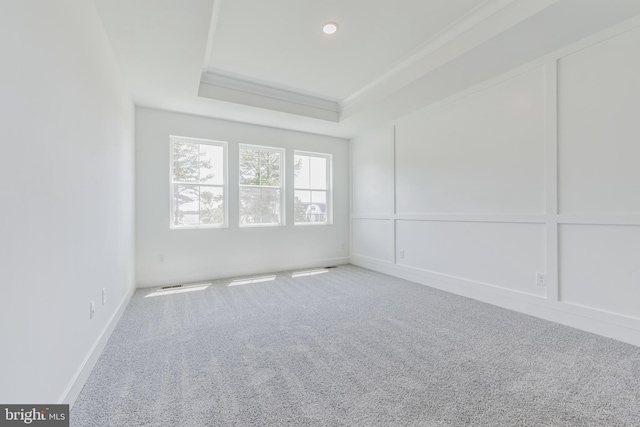 36365 Gate Dr, Georgetown, DE 19947 - carpeted empty room featuring a tray ceiling and crown molding