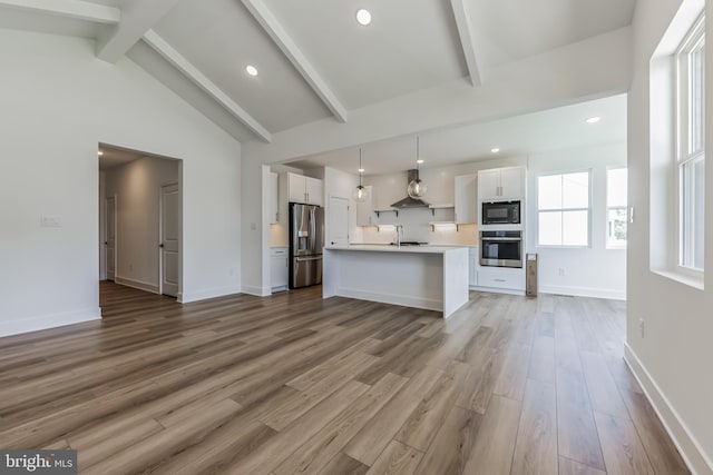 36365 Gate Dr, Georgetown, DE 19947 - kitchen featuring stainless steel appliances, white cabinetry, light countertops, light wood finished floors, and recessed lighting