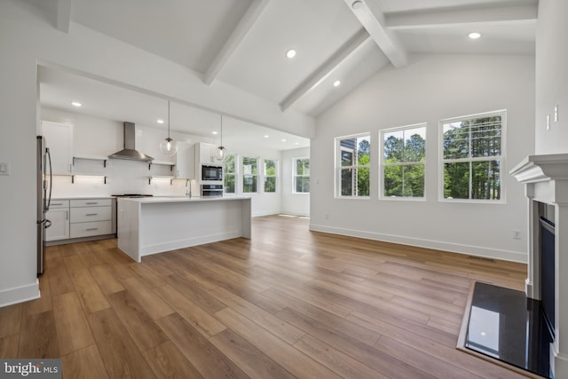 36365 Gate Dr, Georgetown, DE 19947 - unfurnished living room with beamed ceiling, recessed lighting, light wood-style flooring, a fireplace, and high vaulted ceiling
