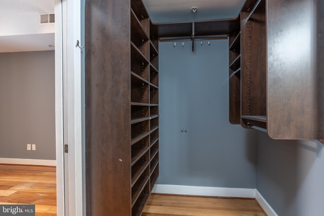910 M St NW Unit 708, Washington, DC 20001 - walk in closet featuring wood finished floors