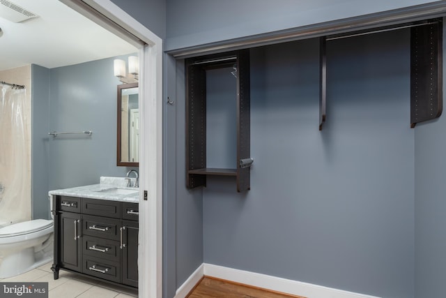 910 M St NW Unit 708, Washington, DC 20001 - full bathroom featuring vanity, a shower with curtain, and tile patterned flooring
