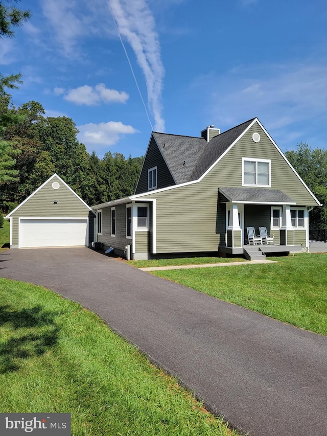 2508 Flagg Meadow Ct, Finksburg, MD 21048 - view of front of property with a detached garage, an outdoor structure, a chimney, covered porch, and a front lawn