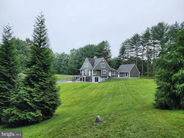 2508 Flagg Meadow Ct, Finksburg, MD 21048 - rear view of property with a chimney, a lawn, and stairs