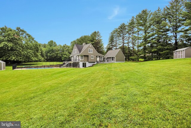 2508 Flagg Meadow Ct, Finksburg, MD 21048 - view of green lawn with a shed, a swimming pool, and stairway